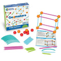 Geometric building kit with box, colorful rods, orange and red balls, cards, and a built 3D rectangular prism.