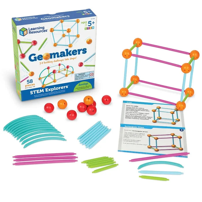 Geometric building kit with box, colorful rods, orange and red balls, cards, and a built 3D rectangular prism.