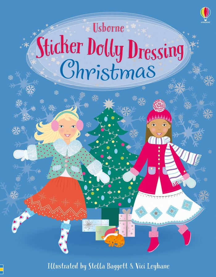 Book cover with two girls in winter coats dancing near a Christmas tree with presents on a snowy blue background.