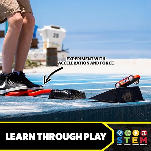Child stomping a red air pump to launch an orange toy car off a ramp. Text highlights STEM learning through play.