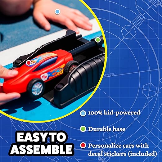 A child places a red toy race car with blue flame decals onto a black launcher base.