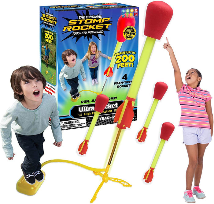 Excited kids look up at yellow foam rockets with red tips, a yellow air launcher, and blue retail box.