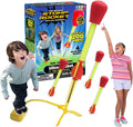 Excited kids look up at yellow foam rockets with red tips, a yellow air launcher, and blue retail box.