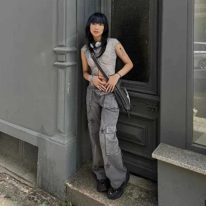 Women’s grey street retro low-rise denim cargo pants by Mead's Supply & Equipment Outfitters, featuring classic cargo pockets and relaxed fit.
