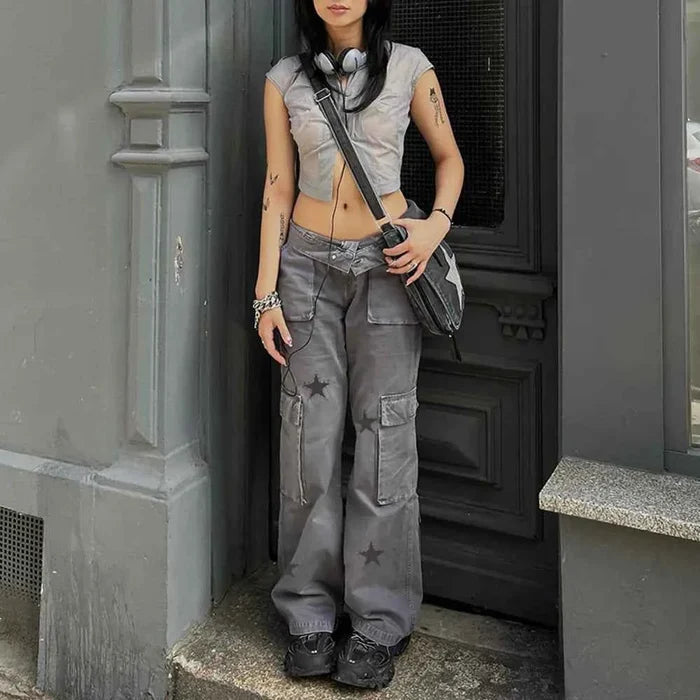 Women's grey Street Retro low-rise denim cargo pants by Mead's Supply & Equipment Outfitters, featuring a relaxed fit and multiple pockets.