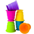 Six colorful silicone cups with suction bases in purple, pink, yellow, blue, green and orange, stacked and tipped.