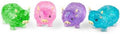Four translucent, textured Highland cow toys in green, pink, purple, and blue with tiny yellow horns and ears.