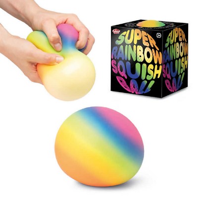 Hands squeezing a large rainbow-colored stress ball next to its black branded box and a round, multicolored ball.