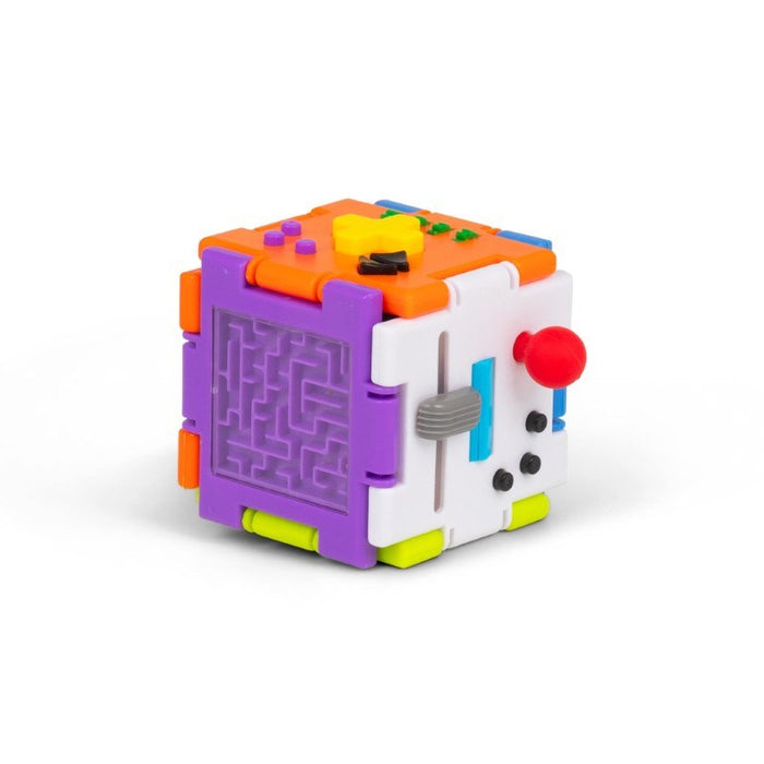 Multi-colored modular sensory cube with a clear maze, red joystick, yellow D-pad, and grey sliders on bright panels.