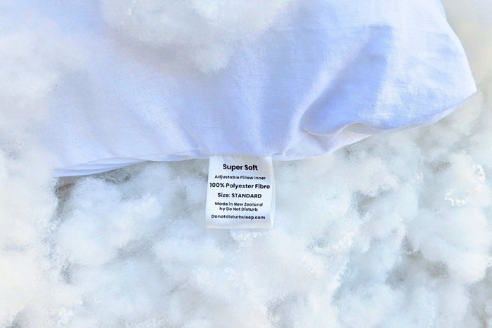 Super soft pillow by Do Not Disturb Sleep Company with plush fabric and comfortable design for restful sleep.