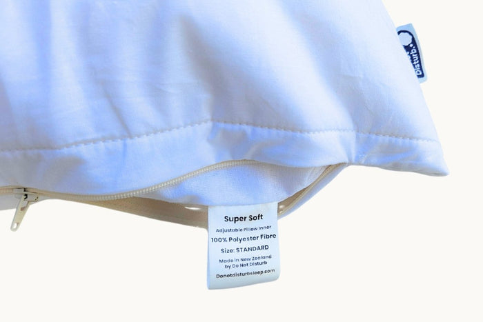 Super soft pillow from Do Not Disturb Sleep Company with plush fabric and comfortable design for restful sleep.