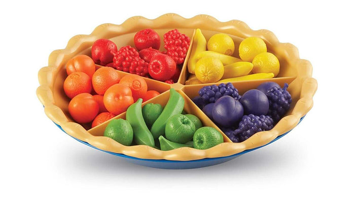 Tan toy pie tray with five sections holding colorful red, orange, yellow, green, and purple plastic fruit sorted by color.
