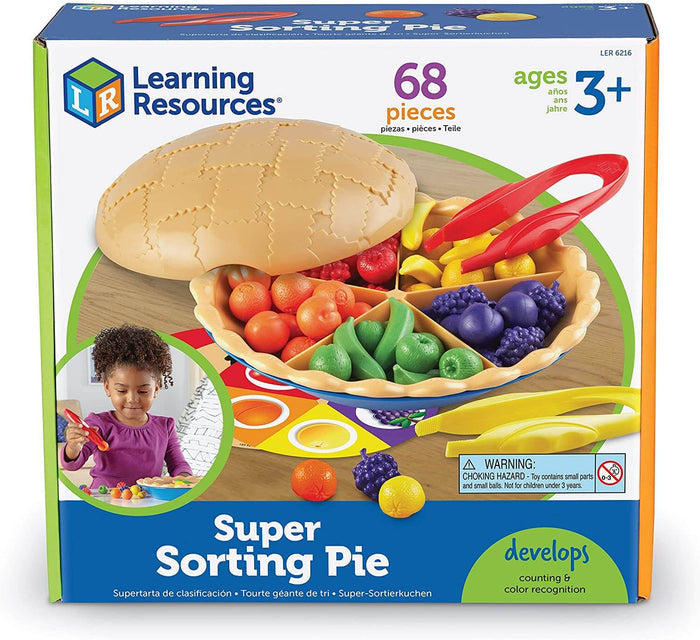 Learning Resources toy box showing a tan pie crust with colorful sorted fruit and jumbo red and yellow tweezers.