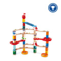Multi-tiered wooden marble run featuring colorful blocks, curved tracks, red spiral funnels, and glass marbles.