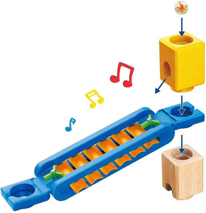 Blue musical chime track for marble run with yellow and wood blocks, showing marble path and colorful music notes.