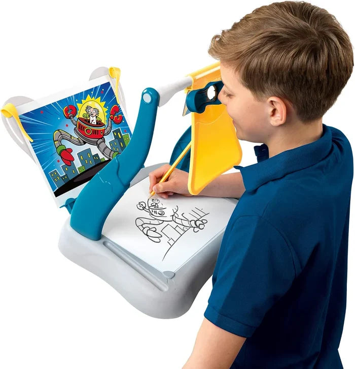 Boy using a blue and yellow optical drawing tool to trace a robot image onto paper on a grey base.
