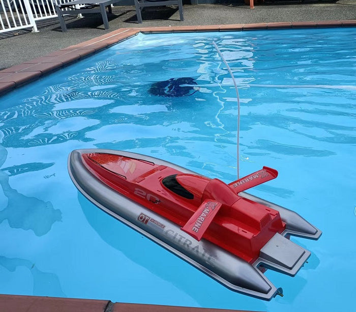 Dealonlinenz high-speed RC racing boat, 80cm long, sleek design, ready for fast water racing on a calm lake or pool.