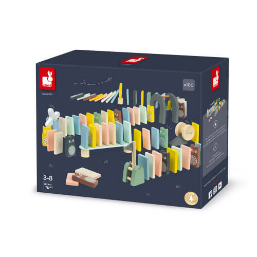 Dark blue box showing 100 pastel wooden dominoes arranged in an obstacle course with a bridge and a bell.