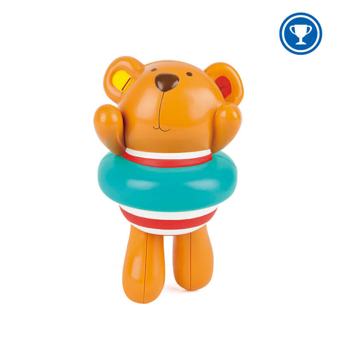 Orange plastic bear toy wearing a teal inner tube and red and white striped swimsuit with arms raised.