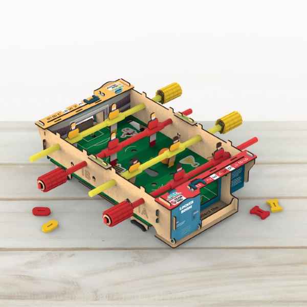Wooden DIY tabletop foosball game featuring red and yellow player rods, a green pitch, and manual score counters.