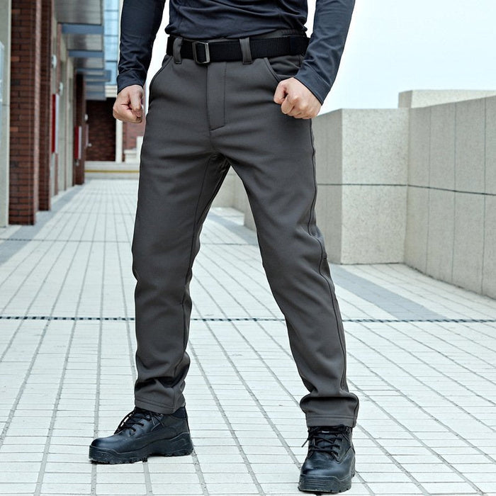 Water-resistant tactical soft shell cargo pants with fleece lining from dealonline.co.nz, featuring multiple pockets and windbreaker material.