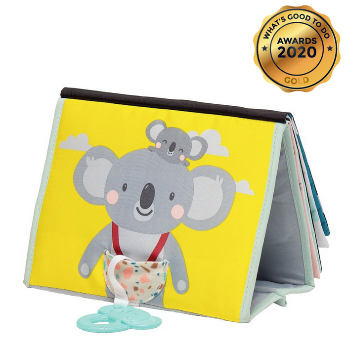 Tented yellow soft baby book featuring koala illustrations, a patterned pocket, and a teal teething ring attached.