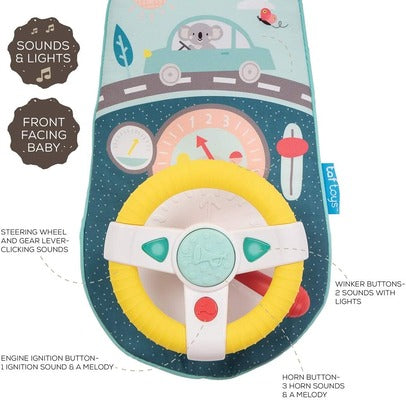 Yellow baby steering wheel toy on a blue mat with koala car illustrations, dashboard graphics, and feature labels.