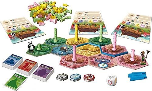 Board game with hexagonal tiles, green, yellow, and pink bamboo stalks, panda and gardener miniatures, and cards.