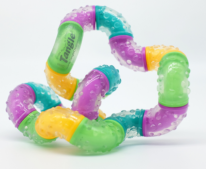 Multi-colored fidget toy with bumpy, translucent segments in purple, green, yellow, and blue, twisted into a knot.