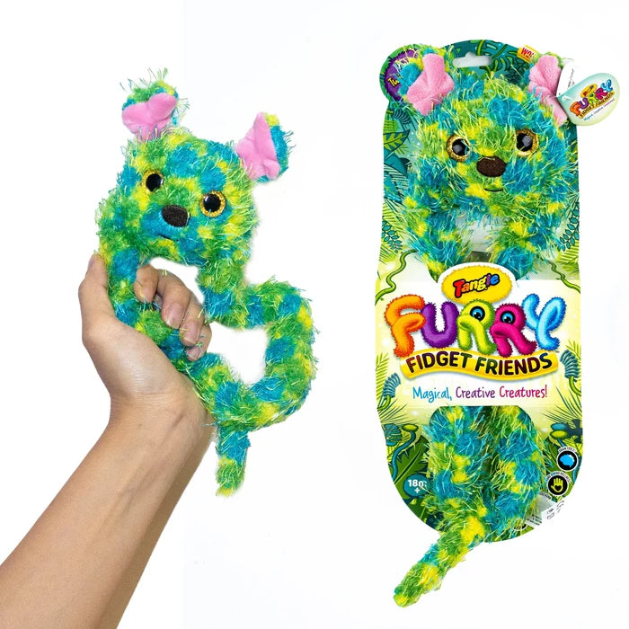 Fuzzy lime green and teal coiled creature with pink ears, shown held in hand and in jungle-themed retail packaging.