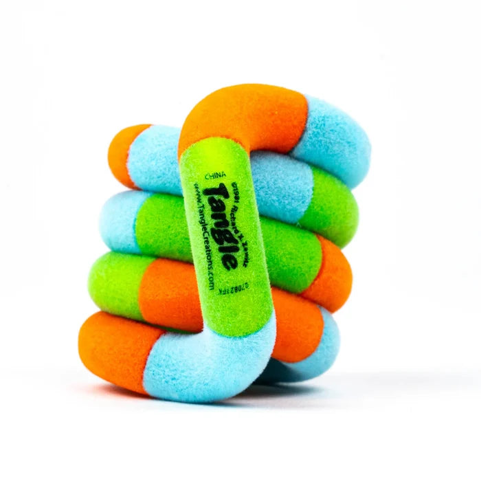 Colorful fuzzy toy with interlocking orange, blue, and green curved segments twisted into a compact coil.