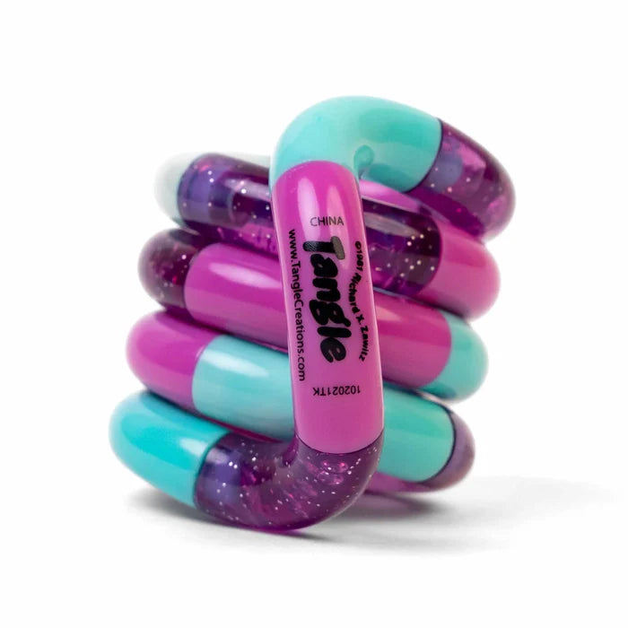 Coiled fidget toy with interlocking teal, pink, and translucent purple glitter segments featuring the Tangle logo.