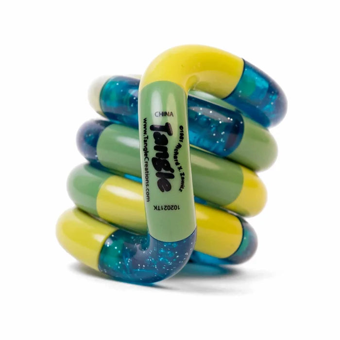 Coiled toy with interlocking yellow, green, and translucent teal glitter segments and the Tangle logo.