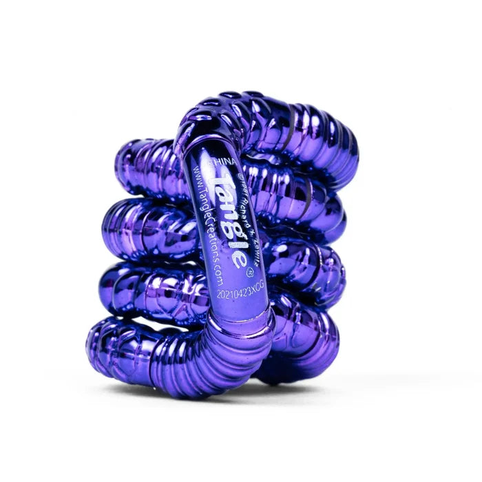 Metallic purple fidget toy with textured, ridged segments twisted into a coil on a white background.