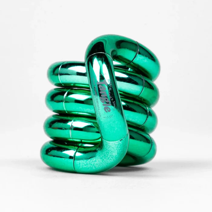 Shiny green metallic Tangle fidget toy twisted into a coiled stack on a white background.