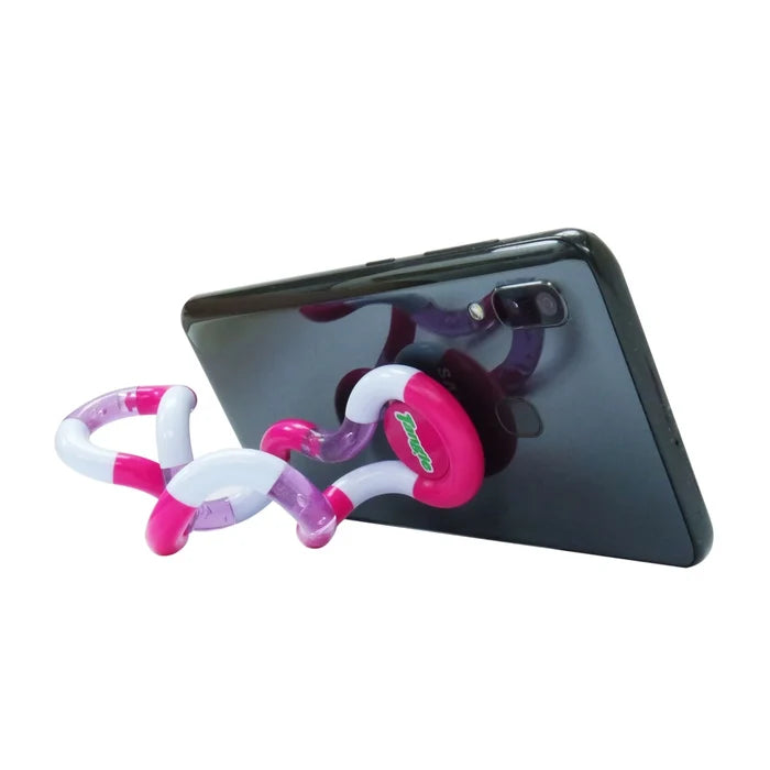 Pink, white, and purple curved segments attached to the back of a black smartphone, acting as a stand.