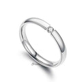 Silver stainless steel tension set ring with 3mm wide glossy mirror polished band and cubic zirconia accents by Glitters