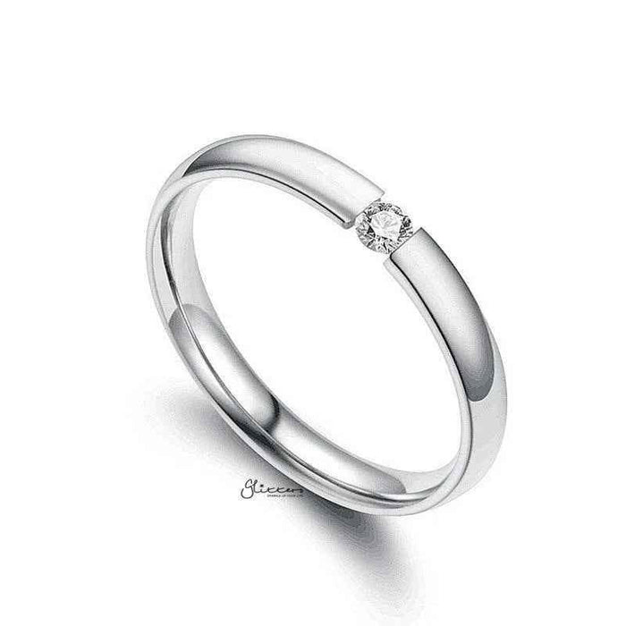 Silver stainless steel tension set ring with 3mm wide glossy mirror polished band and cubic zirconia accents by Glitters