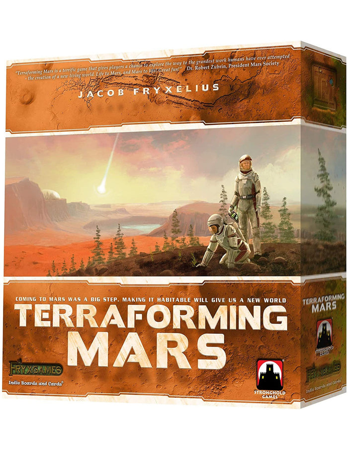 Orange board game box showing two astronauts on a Martian landscape with green trees and a falling comet.
