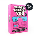 Pink That's Totally You party game box with two blue cartoon hands pointing at each other over a pink button base.
