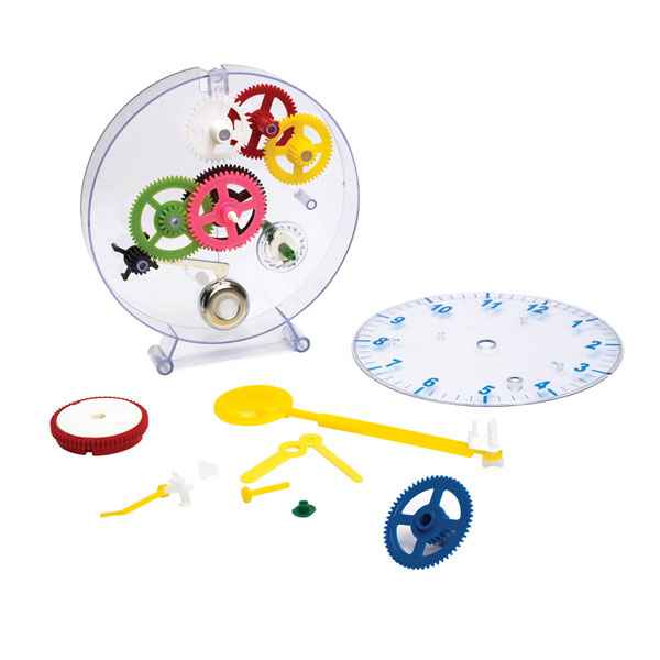 Clear circular clock kit with colorful internal gears, a numbered faceplate, and loose yellow and blue assembly parts.