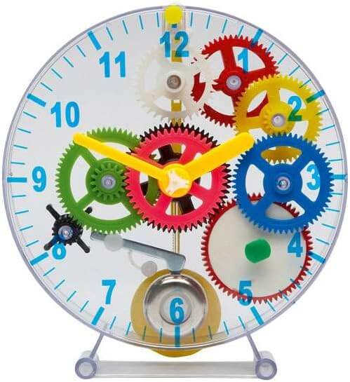 Round transparent clock with visible multi-colored gears, blue numbers, and yellow hands on a clear stand.