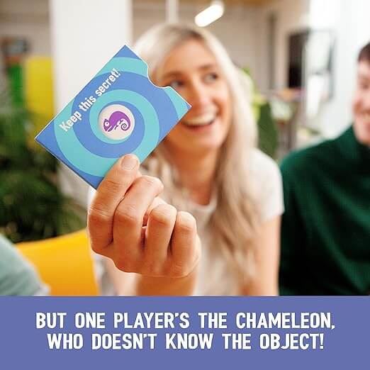 Hand holding a blue swirled card sleeve revealing a purple chameleon icon. Sleeve text: Keep this secret!