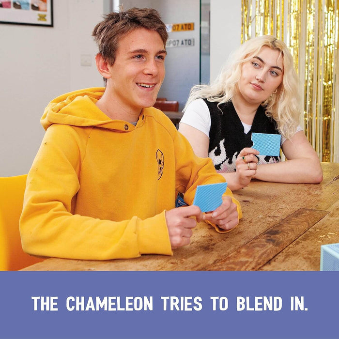 Boy in yellow hoodie and girl holding blue square cards. Text: THE CHAMELEON TRIES TO BLEND IN.