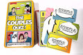 Yellow comic-style tin with pop art illustrations and fanned out blue, green, and yellow game cards.