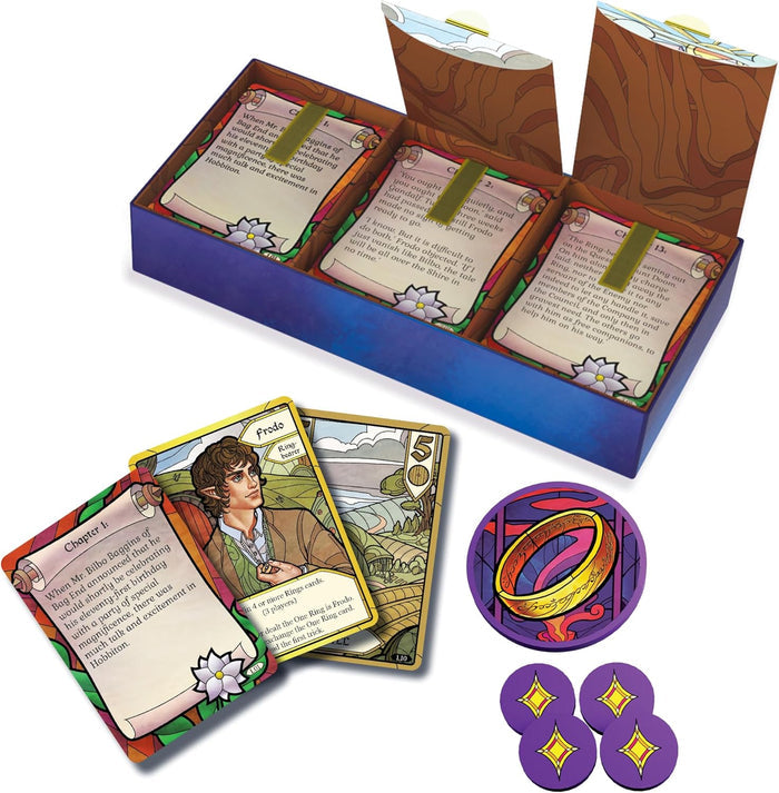 Blue box with stained-glass style game cards, a Frodo card, a gold Ring token, and four purple star tokens.