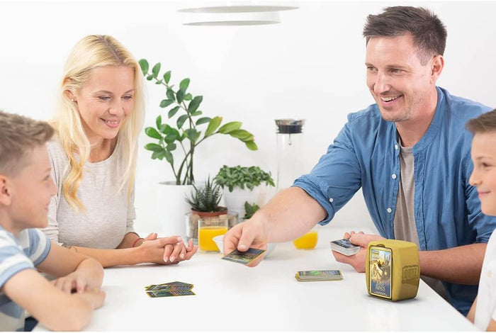 Family playing with a yellow Lord of the Rings quiz case and character cards on a white table.