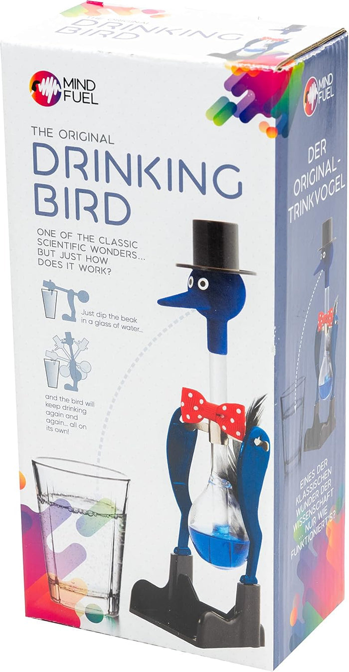 Packaging for a blue glass drinking bird with a top hat and red bow tie, shown dipping into a glass of water.