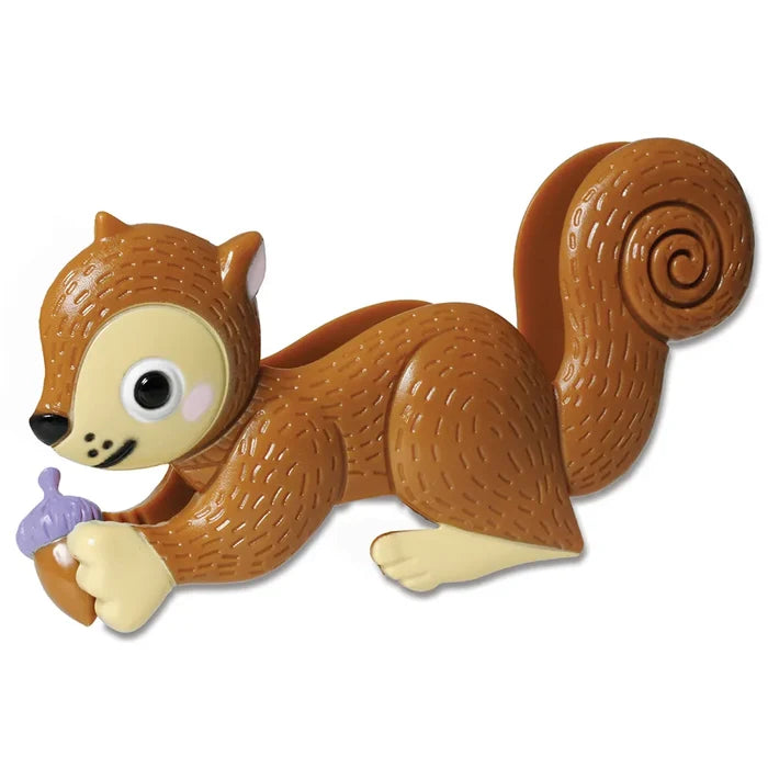 Brown squirrel-shaped plastic tweezers with a large curled tail, holding a small purple and tan acorn.
