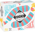 White game box featuring a large teal and red striped sock and a black diamond logo with the title The Sock Game.